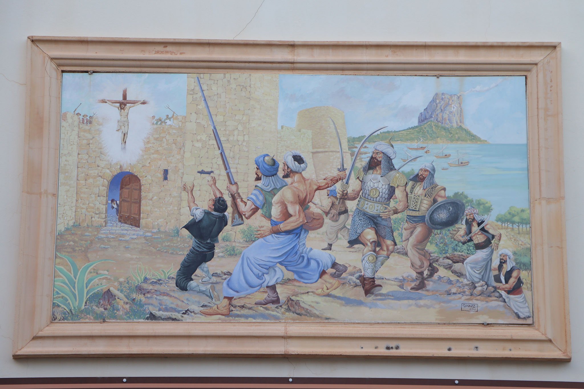 Mural frente al torreón que retrata el origen de las fiestas patronales de Calp