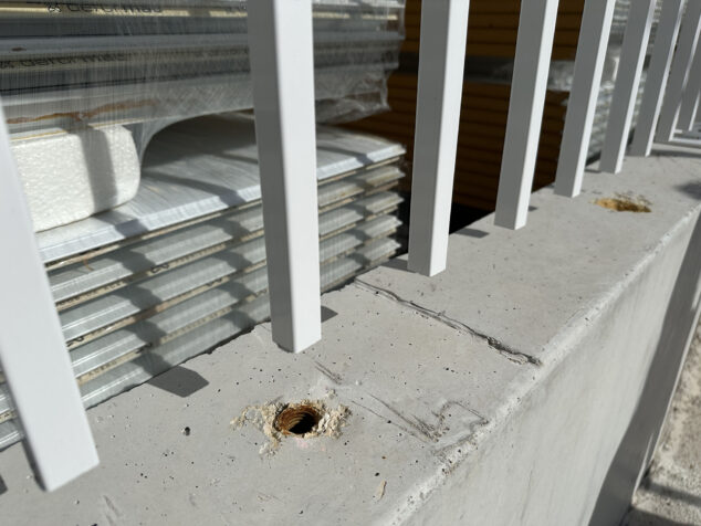Image: Holes in the concrete that supports the fence of the CEIP Oltà and IES Les Salines schools in Calp
